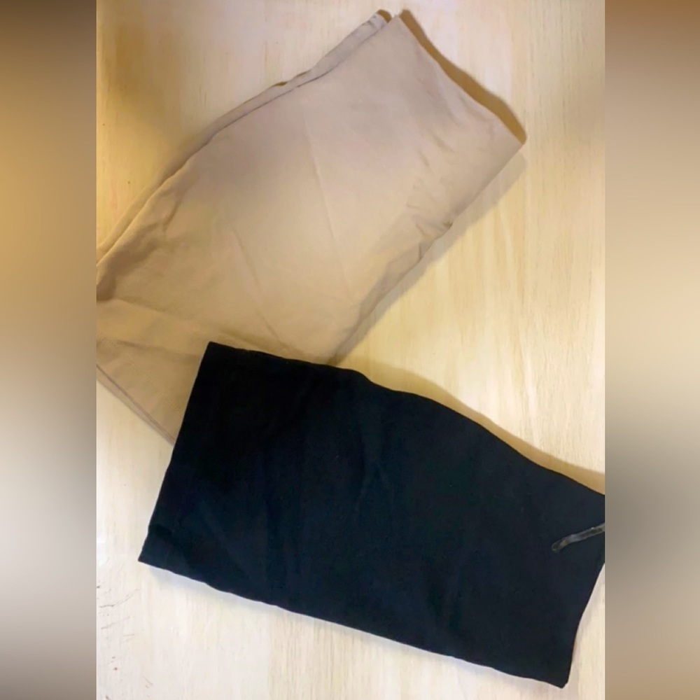 One (1) nude and one (1) black form fitting mini skirts. Both size small (S)